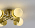 Bethel International 4 Light in Satin Brass Flush Mount With White Glass Globe Shades Model: BLT106C18BR