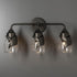 Hubbardton Forge Lapas 3 Light Bath Sconce in Black Finish Model: 201352-SKT-10-GG0330