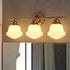 Vaxcel Huntley 3 Light Vanity in Natural Brass Model: W0453